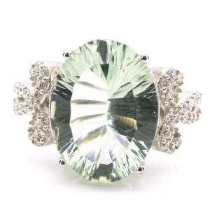 Серебряное кольцо 925 пробы 5,61 гр. с зеленым аметистом лазерной огранки и цирконами 7,76 карат