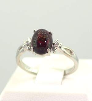 Серебряное кольцо 925 пробы 2,43 гр. с черным эфиопским Опалом класса АААА и топазами из США 1,2 карат Серебряное кольцо 925 пробы 2,43 гр. с черным эфиопским Опалом класса АААА и топазами из США 1,2 карат