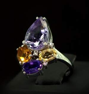Серебряное кольцо 925 пробы 4,35 г с Аметистами, лимонами та фианитами 4,62 карат Серебряное кольцо 925 пробы 4,35 г с Аметистами, лимонами та фианитами 4,62 карат