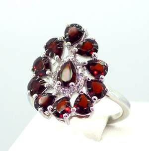 Серебряное кольцо 925 пробы 4,43 г с мозамбикскими Гранатами и цирконами 4,81 карат Серебряное кольцо 925 пробы 4,43 г с мозамбикскими Гранатами и цирконами 4,81 карат